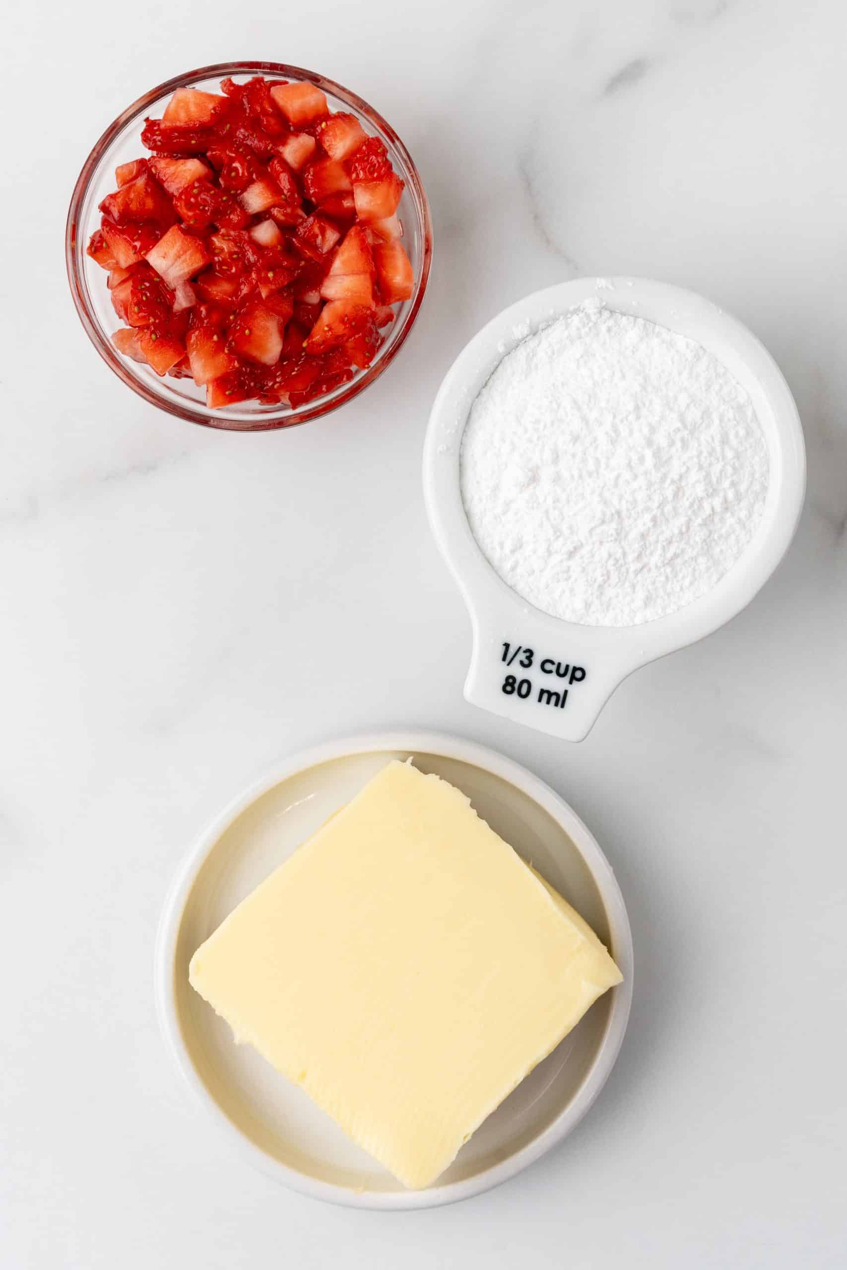 an overhead image showing the measured ingredients needed to make a batch of homemade strawberry butter