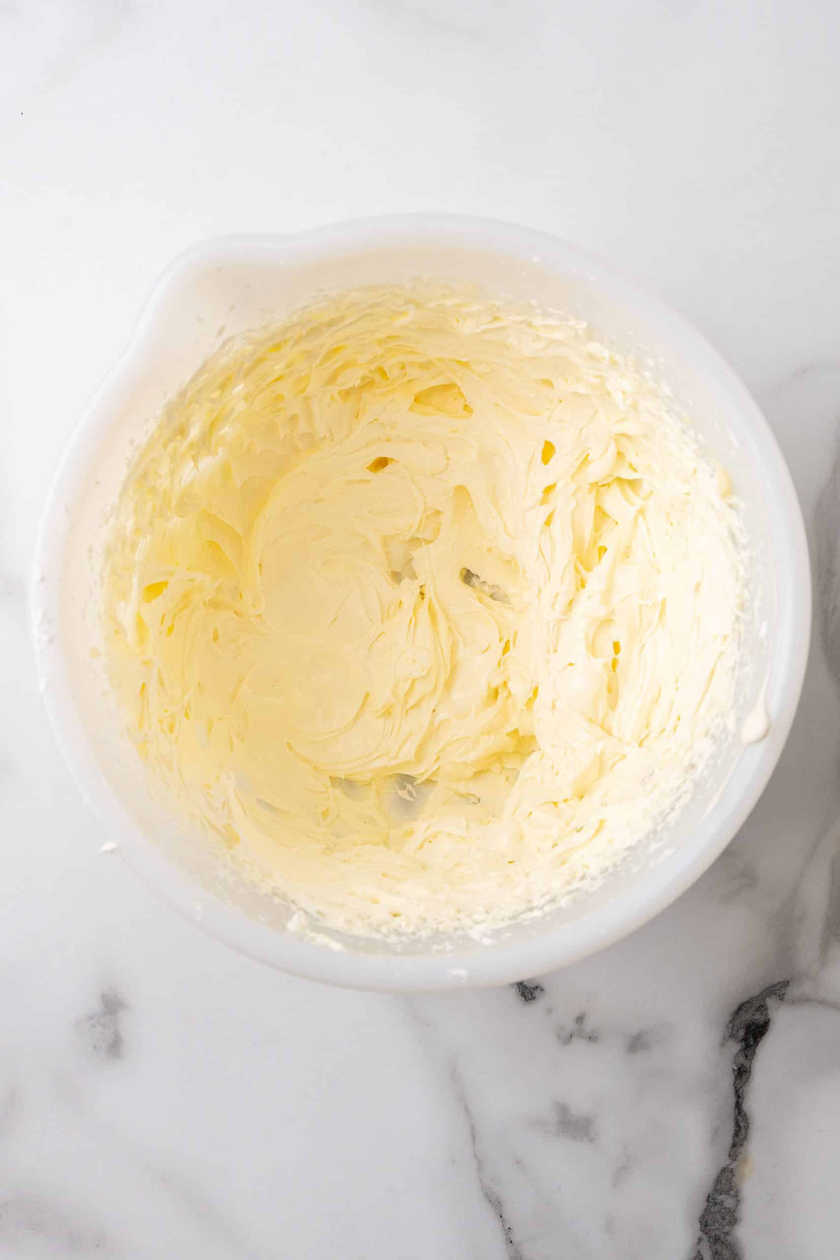 whipped butter in a white mixing bowl