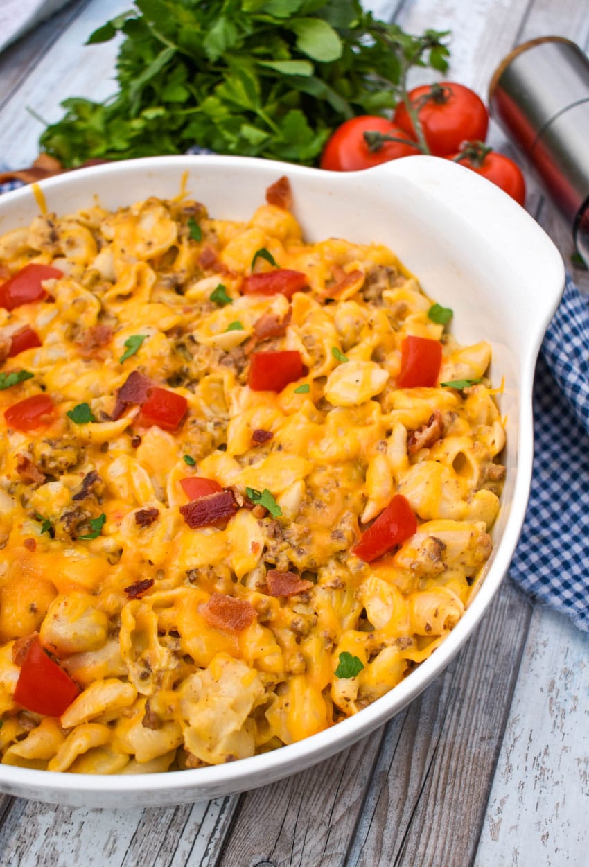 bacon cheeseburger mac and cheese in a large white serving bowl
