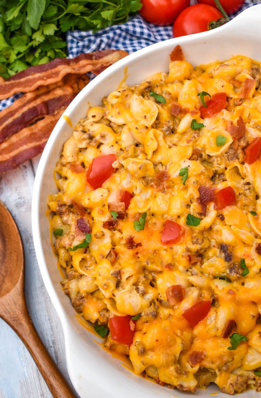 bacon cheeseburger mac and cheese in a large white serving bowl
