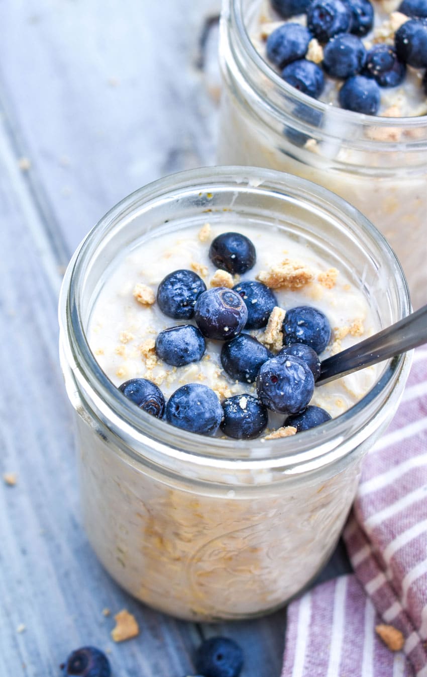 blueberry cheesecake overnight oats in two small glass jars