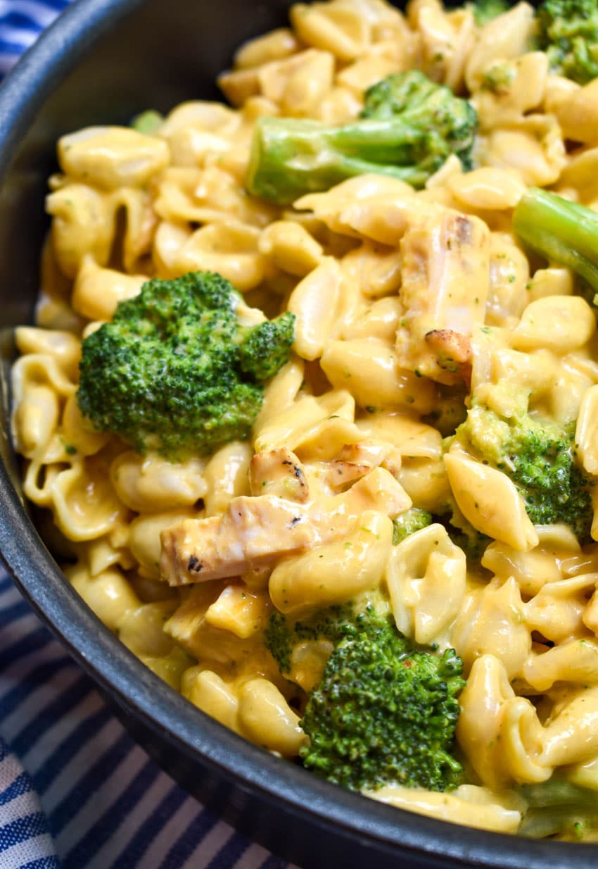 cheesy chicken broccoli macaroni and cheese in a large black pot