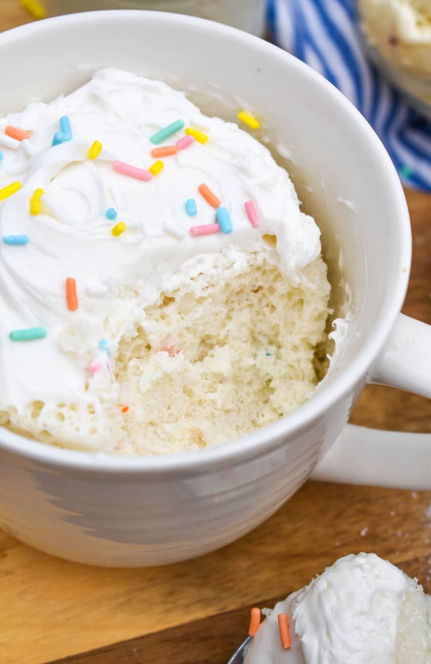 a microwave mug cupcake on a wooden cutting board