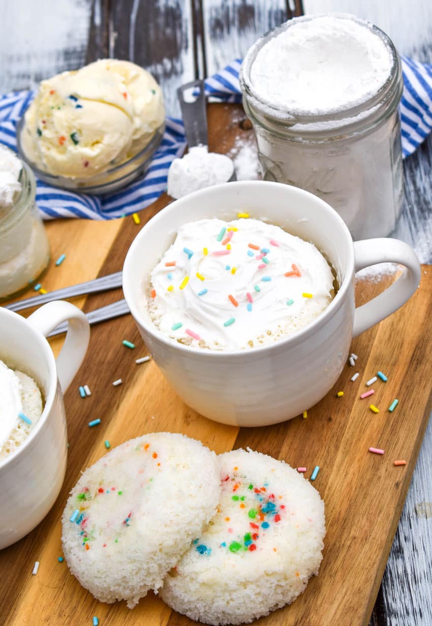a microwave mug cupcake on a wooden cutting board