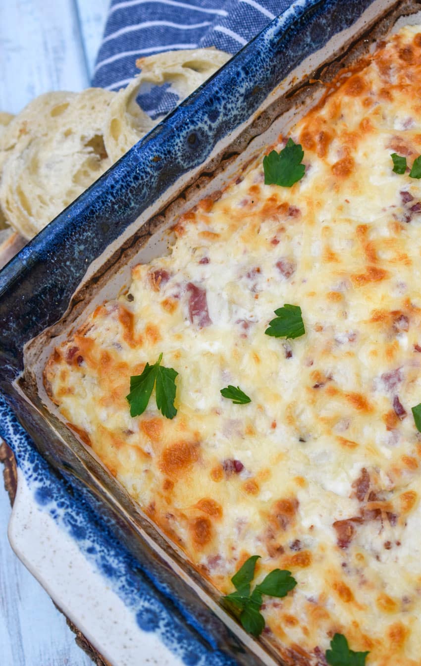 chicken cordon bleu dip in a square baking dish