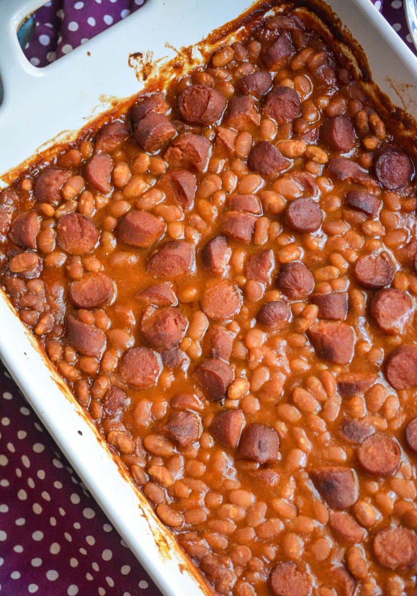grandma's hotdogs and beans casserole in a white baking dish