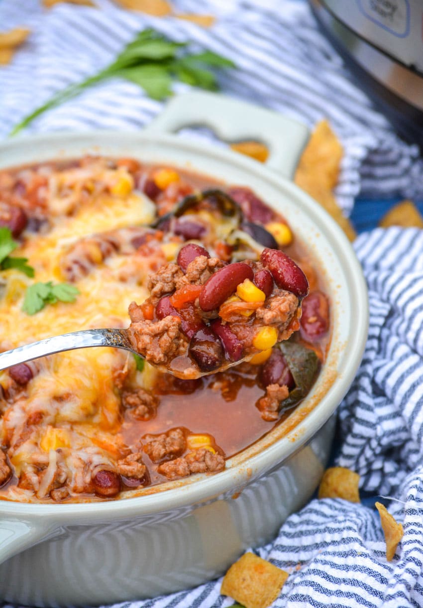 a spoon holding up a scoop of instant pot taco chili