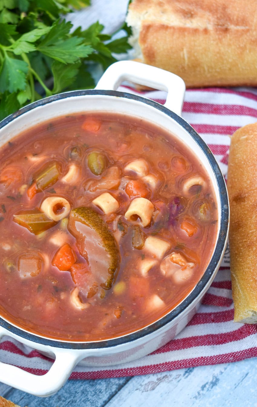 Italian vegetable minestrone soup in two small cast iron bowls