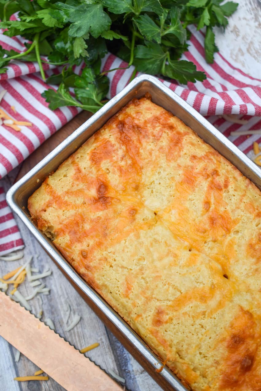 quick and easy cheese bread in a metal loaf pan