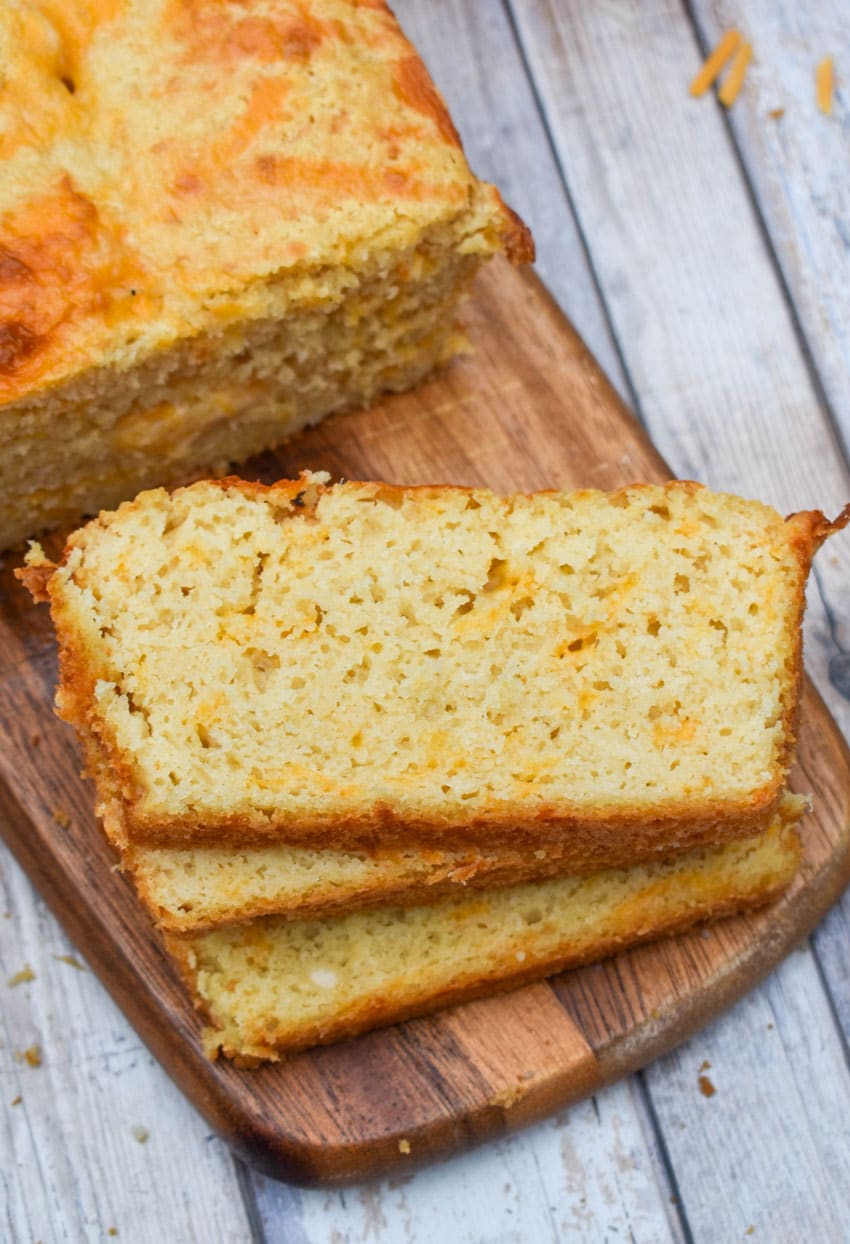 slices of easy cheese bread on a wooden cutting board