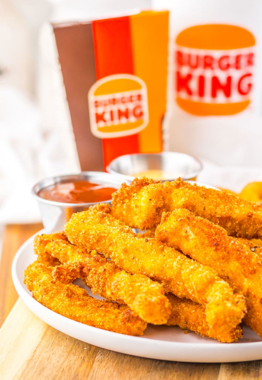 homemade chicken fries piled on a white plate