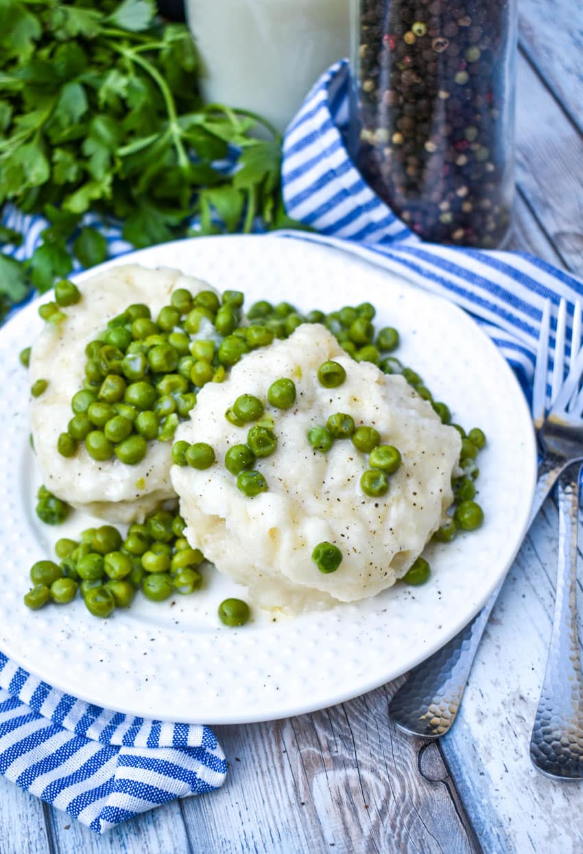 homemade peas and dumplings on a small white plate