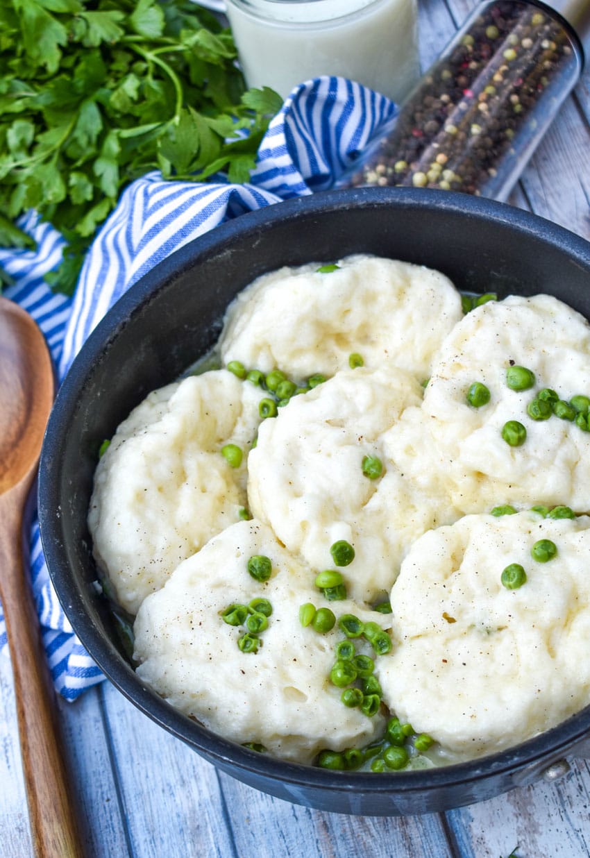 homemade peas and dumplings in a black skillet
