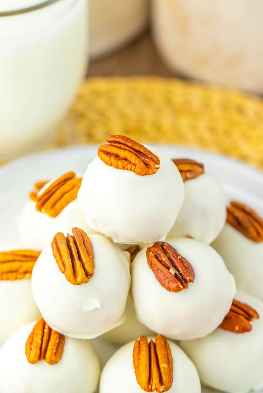 a stack of pecan pie truffles on a white plate