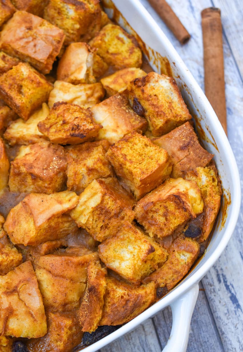 pumpkin bread pudding in a white baking dish