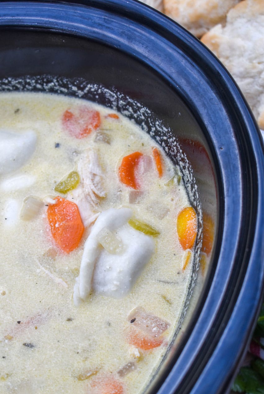 chicken and pierogi stew in a black crockpot