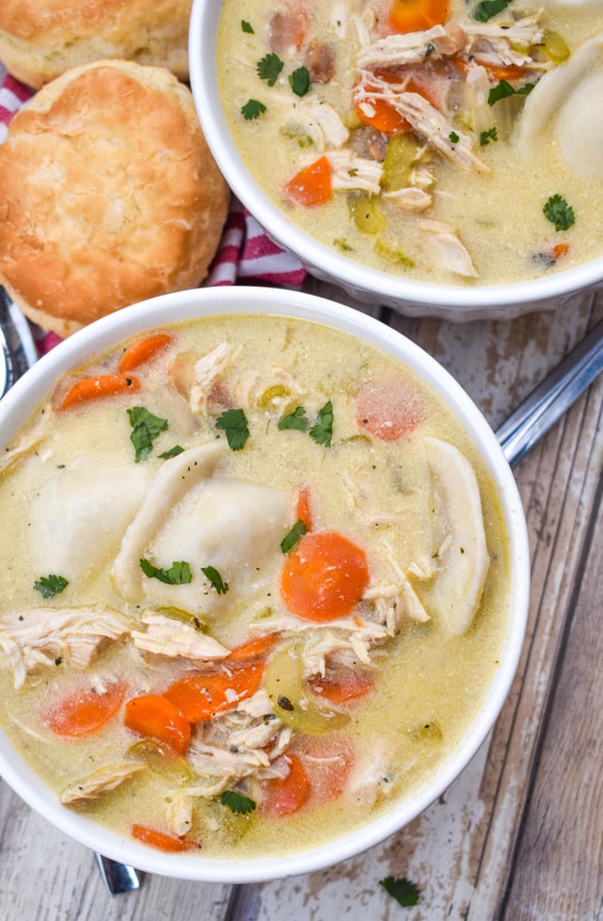 chicken and pierogi stew in two small white soup bowls