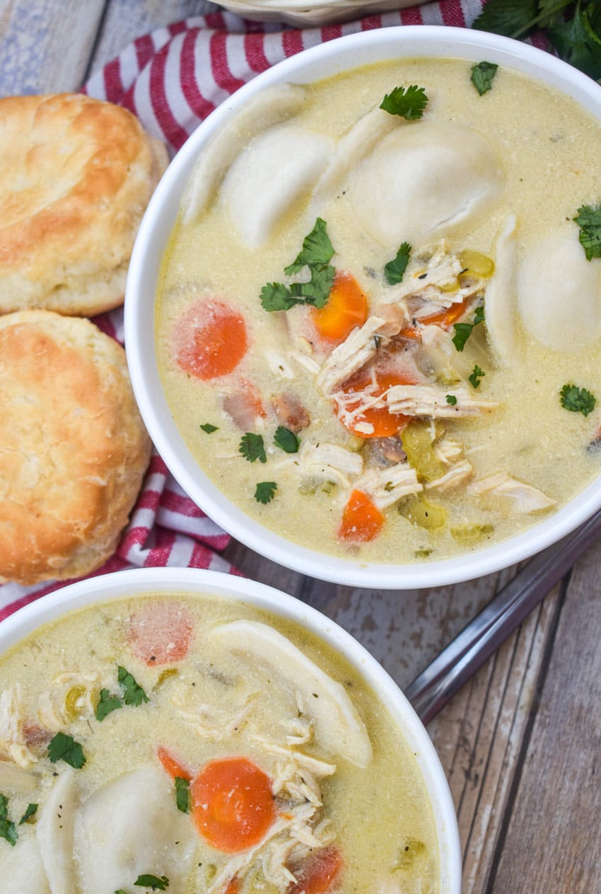 chicken and pierogi stew in two small white soup bowls