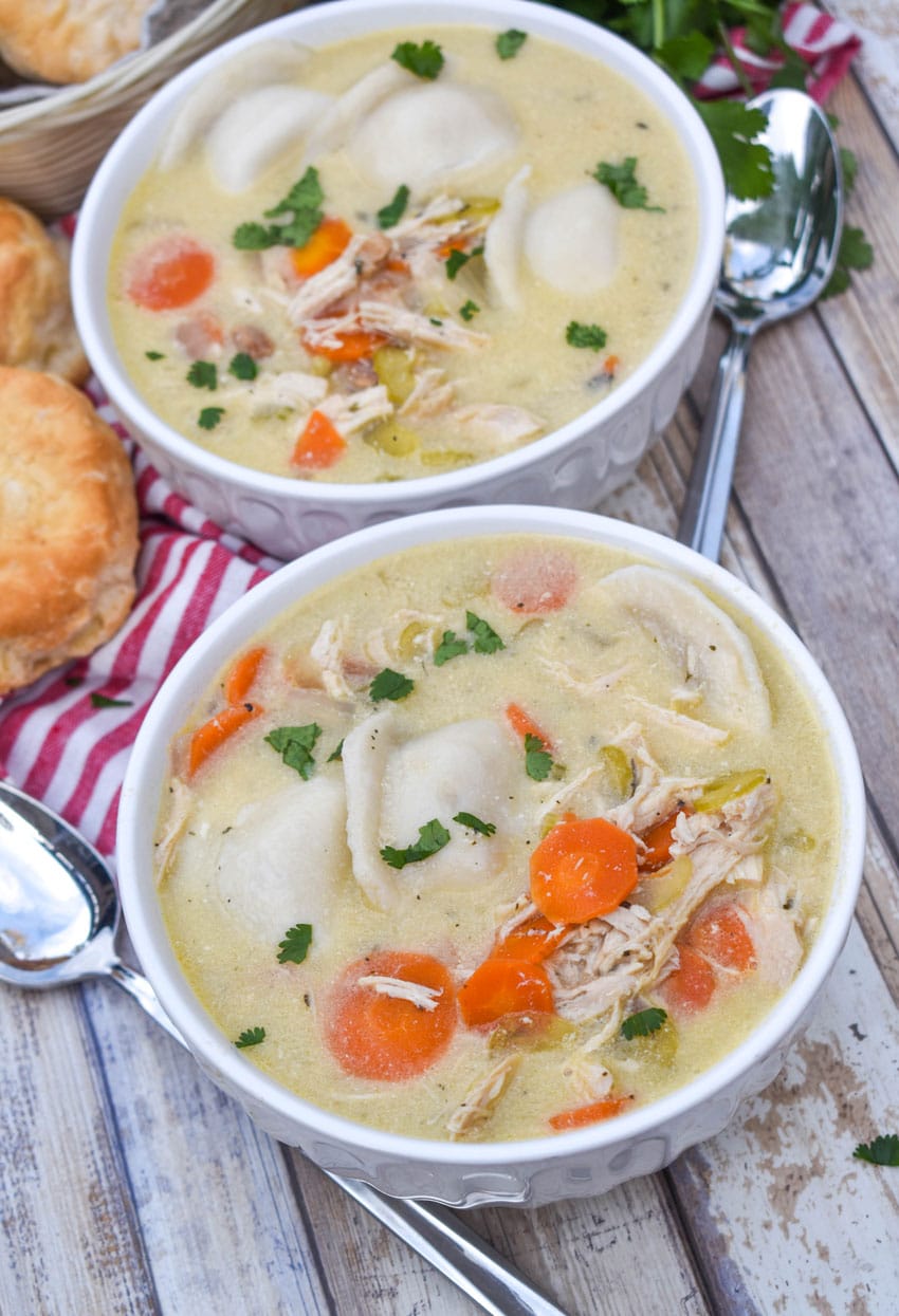 chicken and pierogi stew in two small white soup bowls