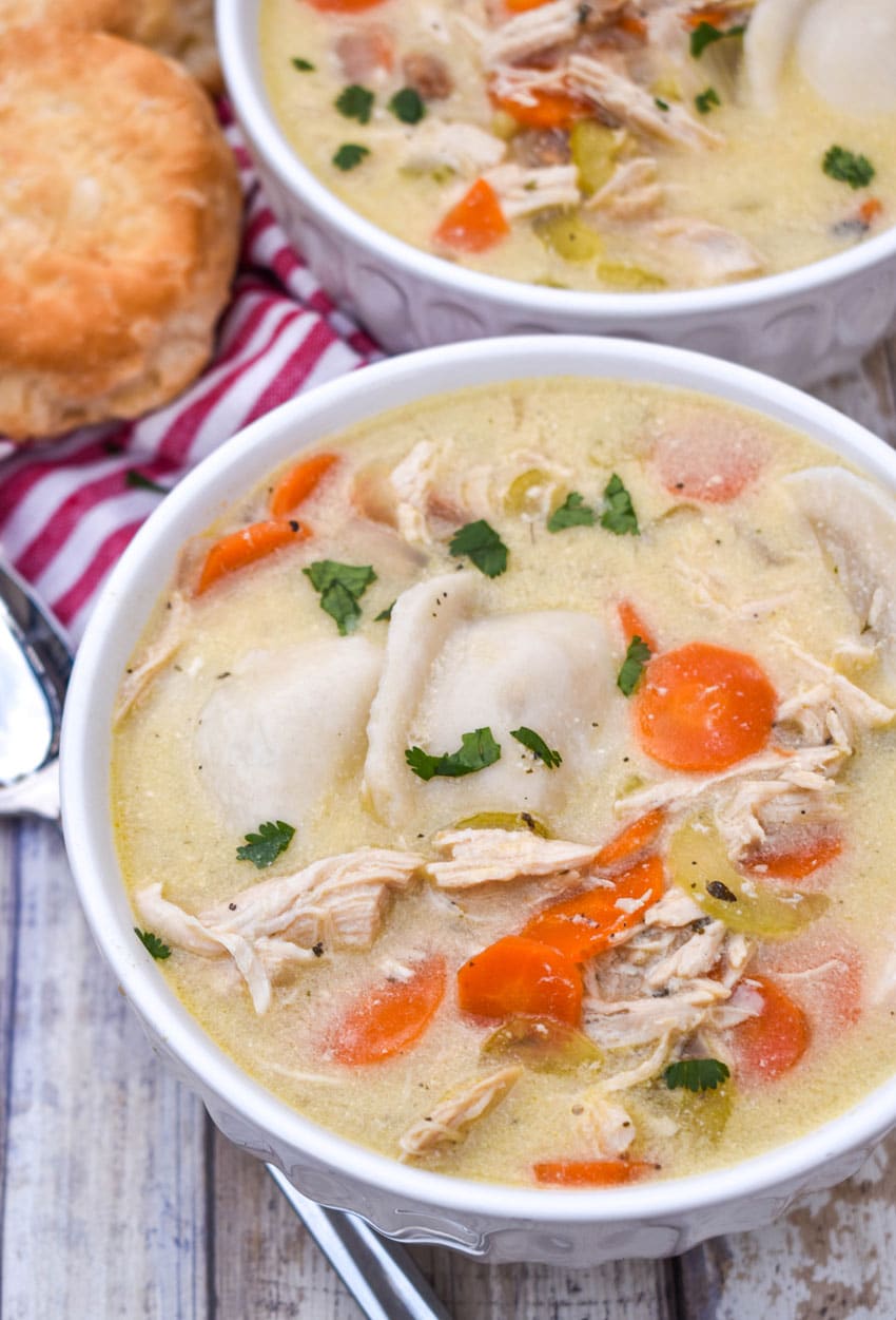 chicken and pierogi stew in two small white soup bowls