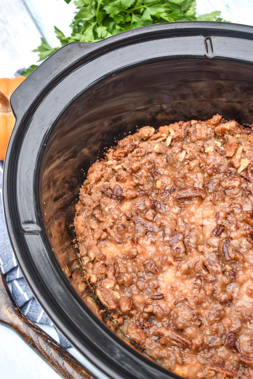 easy sweet potato casserole in the black bowl of a slow cooker