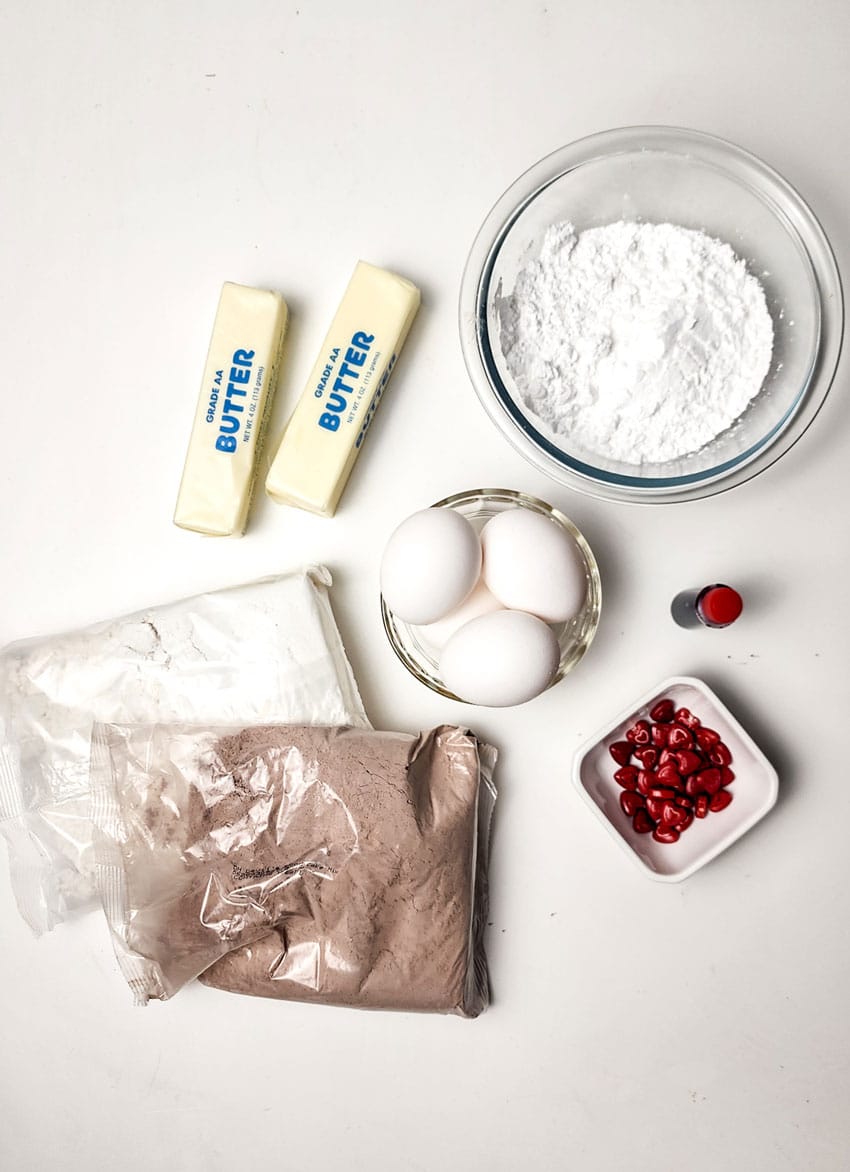 an overhead image showing the measured ingredients needed to make a batch of red velvet crinkle cookies