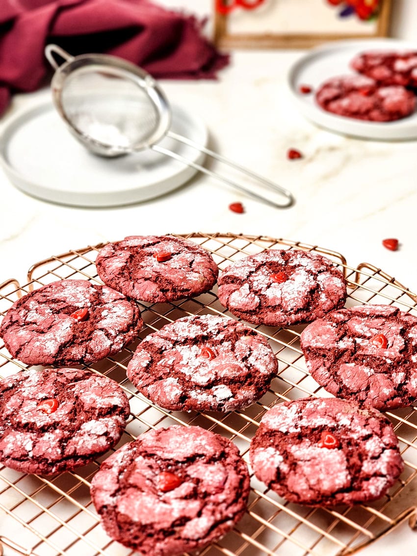 red velvet crinkle cookies cooling on a wire rack