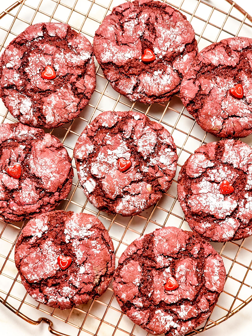 red velvet crinkle cookies cooling on a wire rack