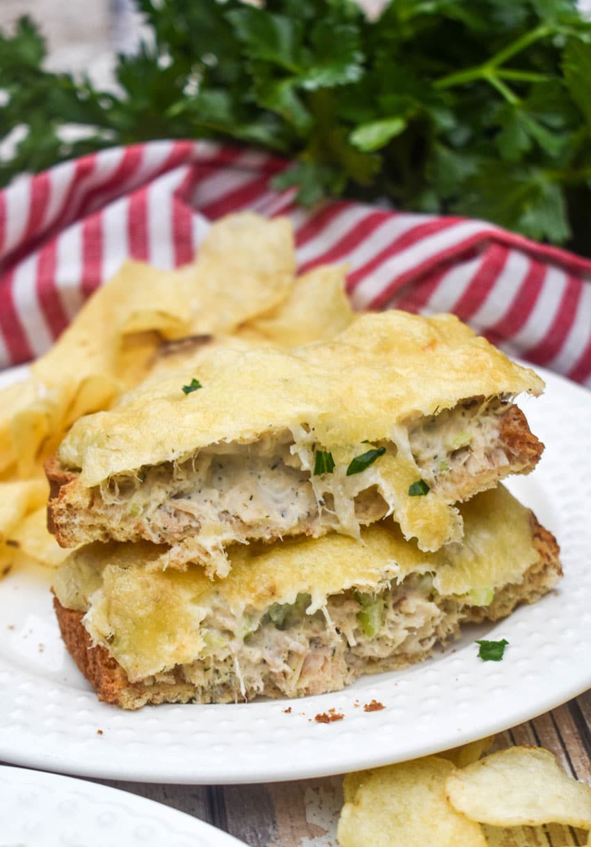 two halves of an air fryer tuna melt sandwich on a small white plate