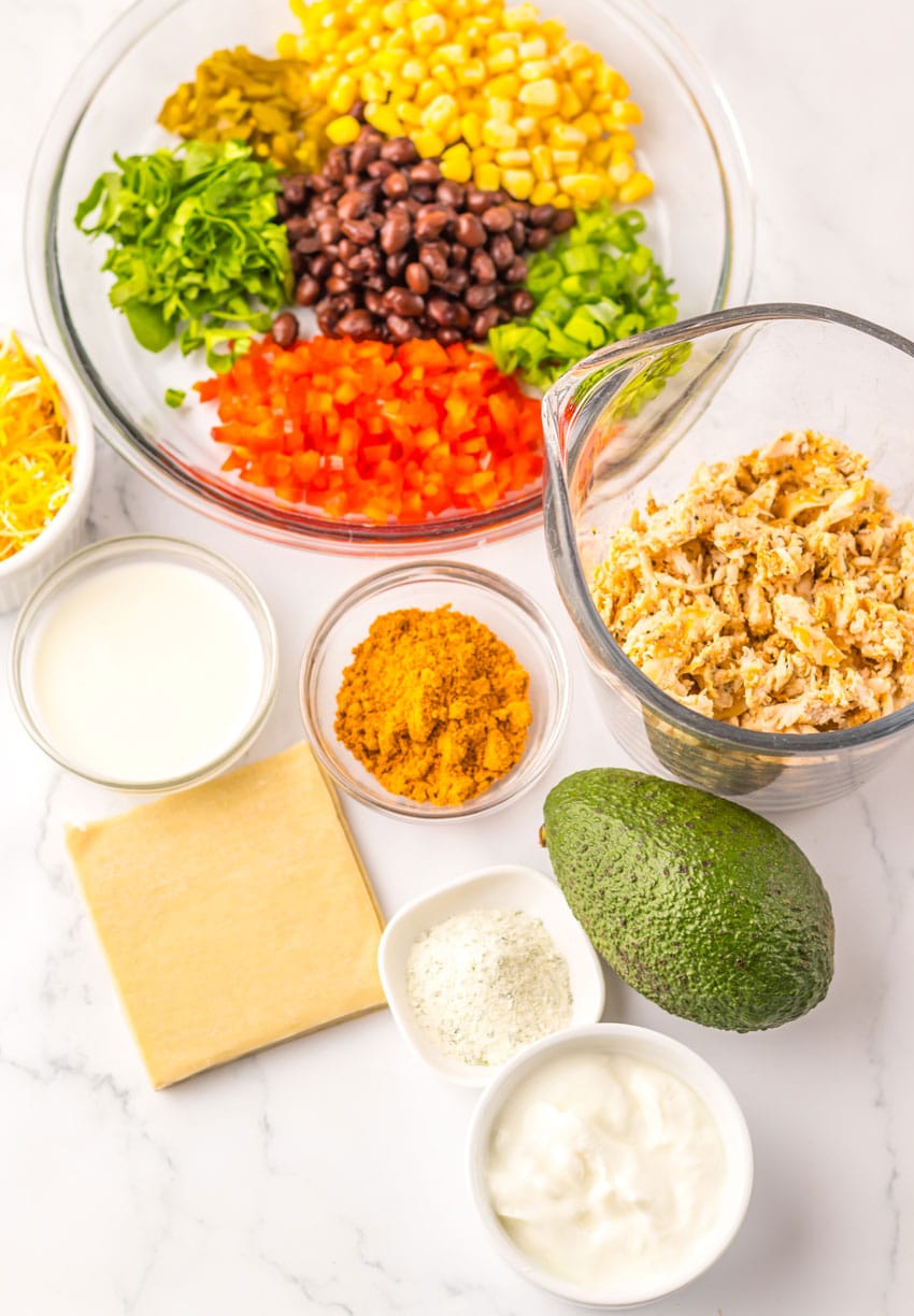 an overhead image showing the measured ingredients needed to make a batch of copycat chili's southwestern egg rolls