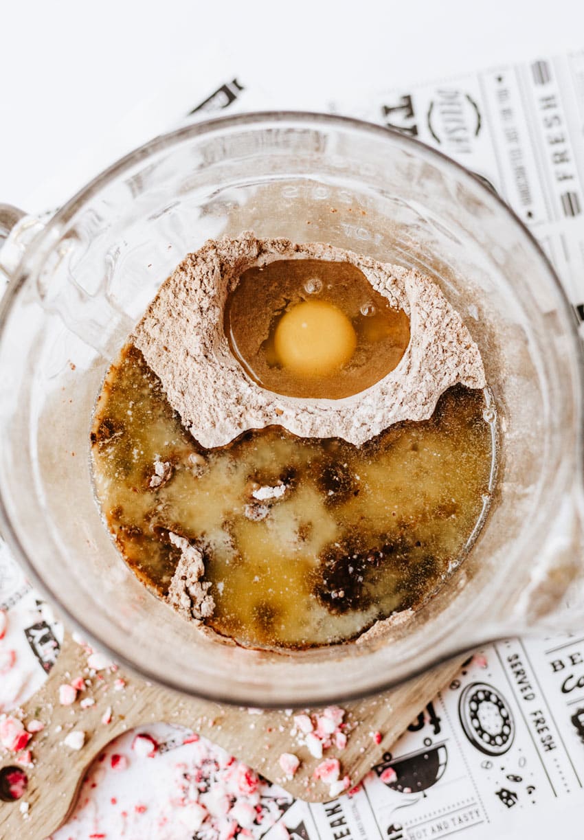 homemade chocolate pancake batter in a glass mixing bowl