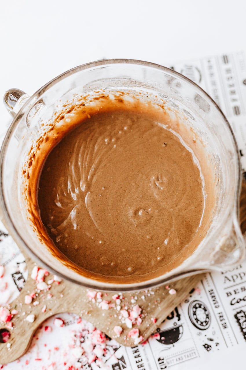 homemade chocolate pancake batter in a glass mixing bowl