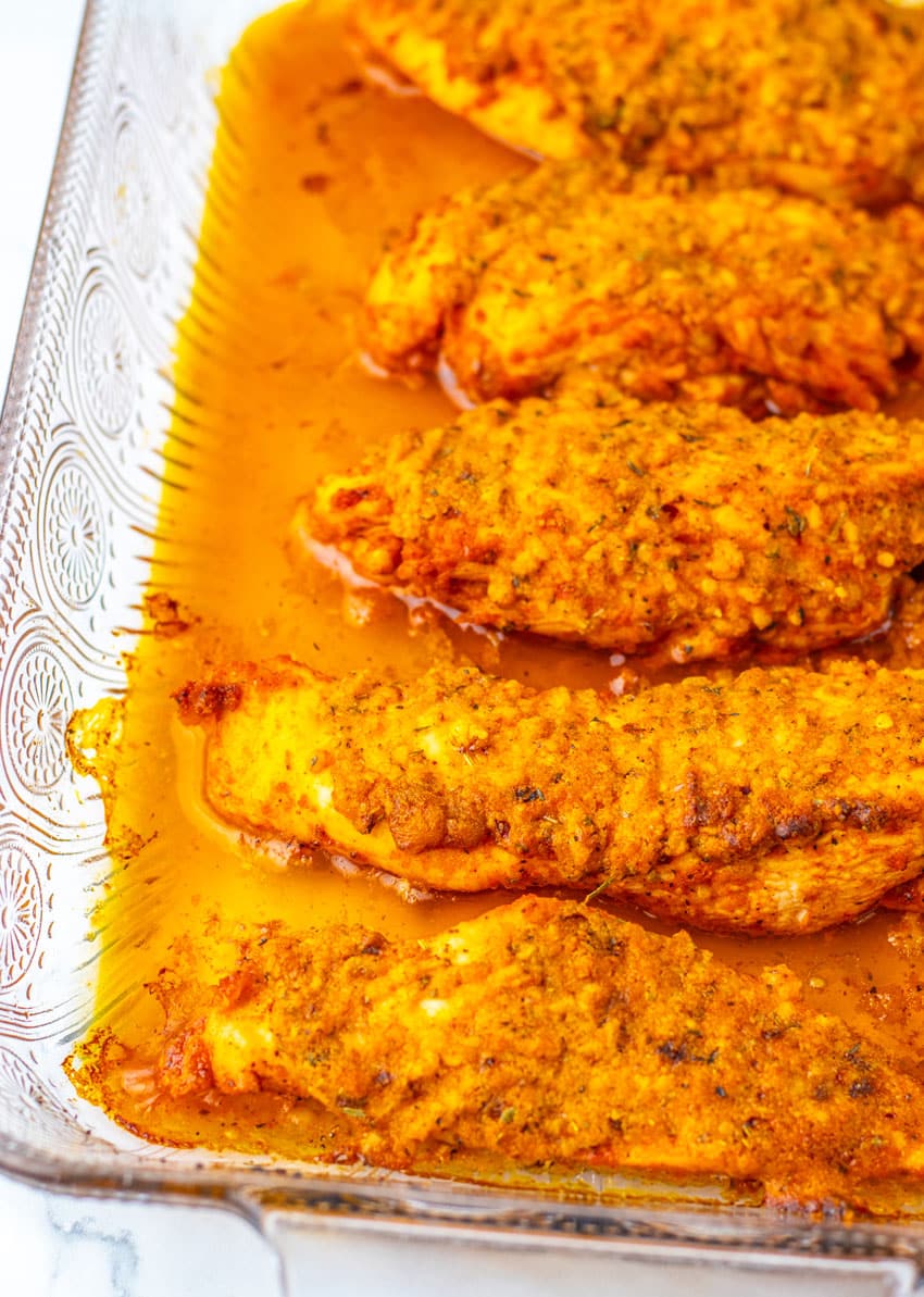 a row of garlic parmesan chicken bake in a large glass dish