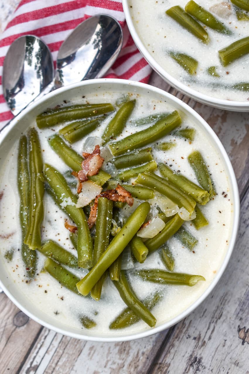 green bean soup in two small white bowls