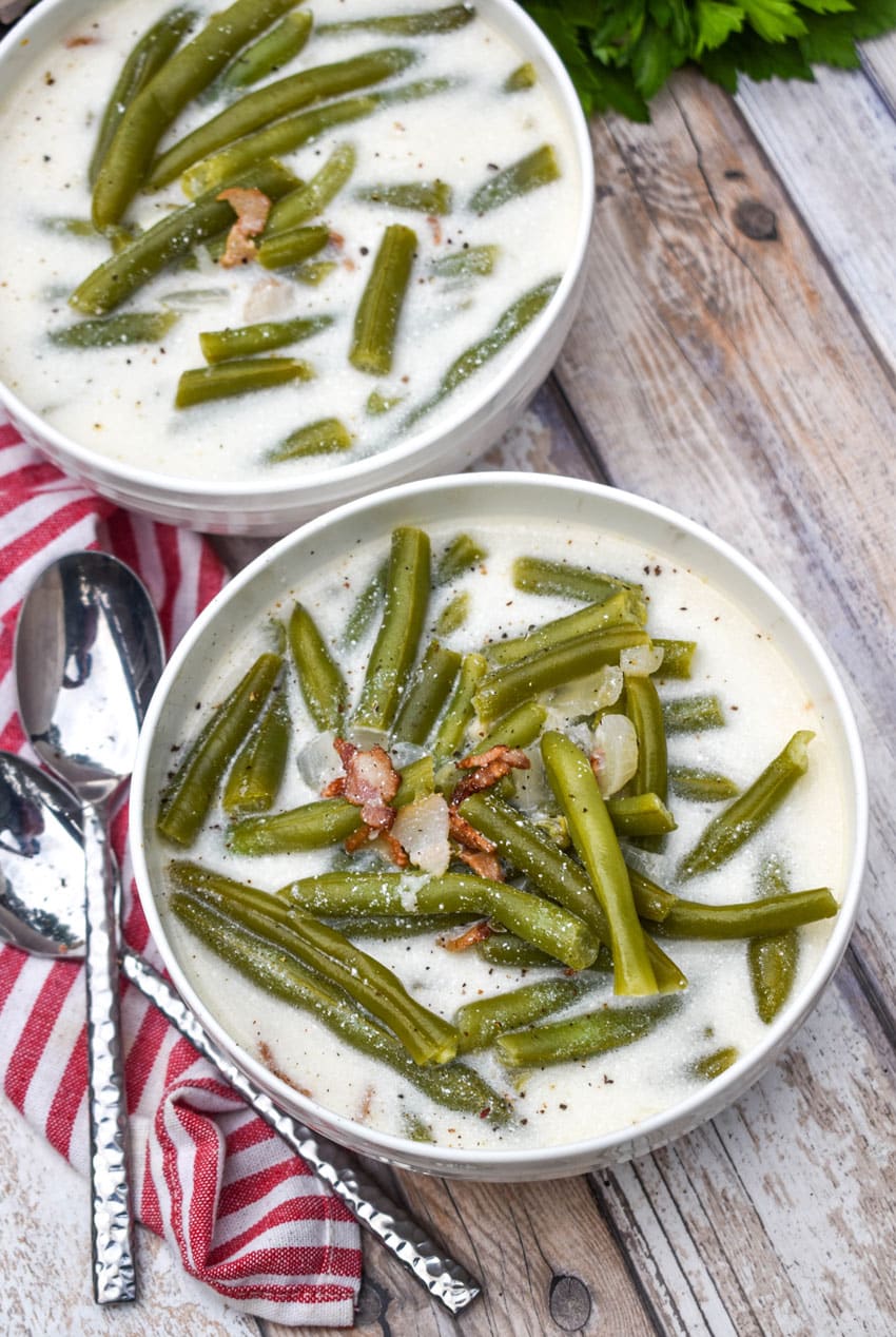 green bean soup in two small white bowls