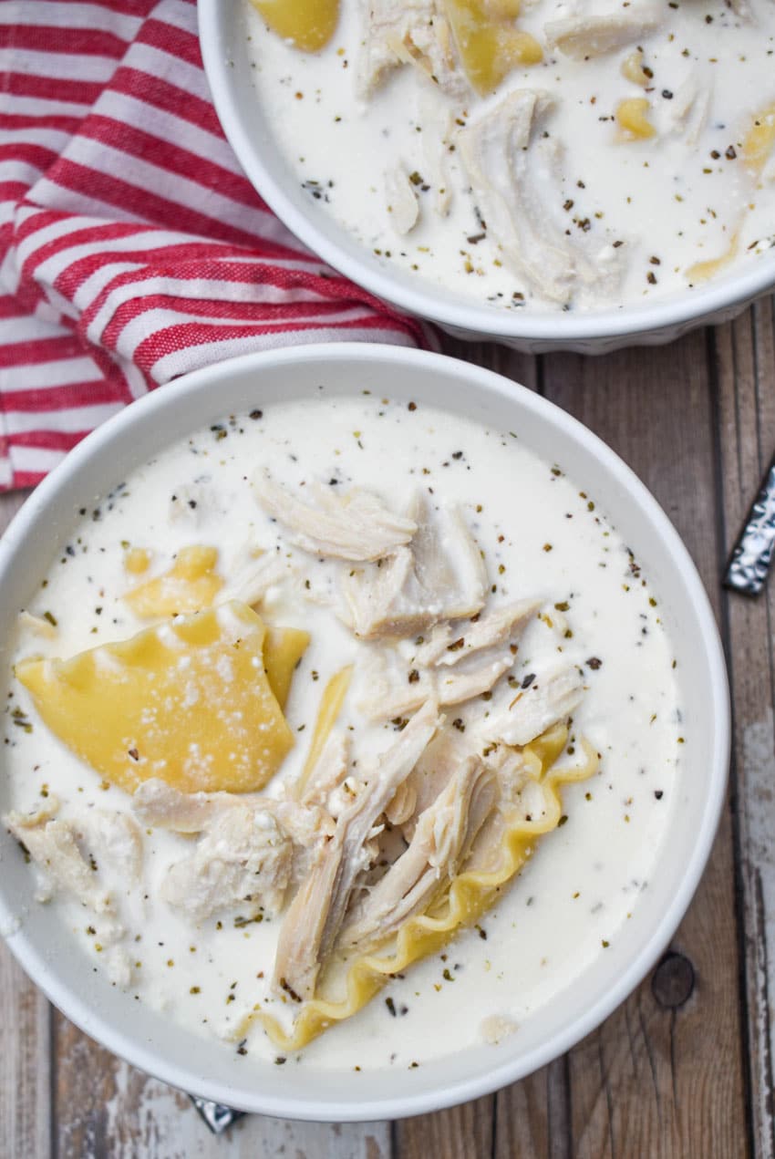 slow cooker white lasagna soup in two white bowls