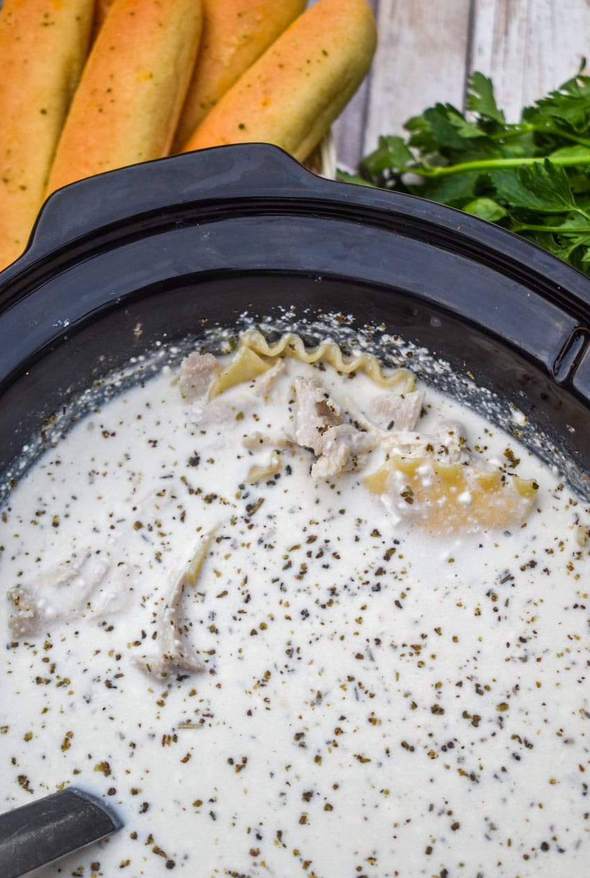 WHITE LASAGNA SOUP IN THE BOWL OF A CROCKPOT