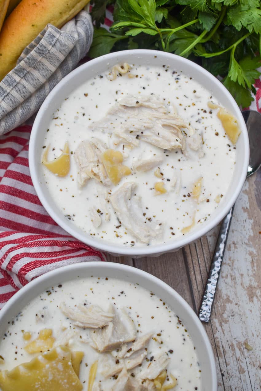 white lasagna soup in two white bowls