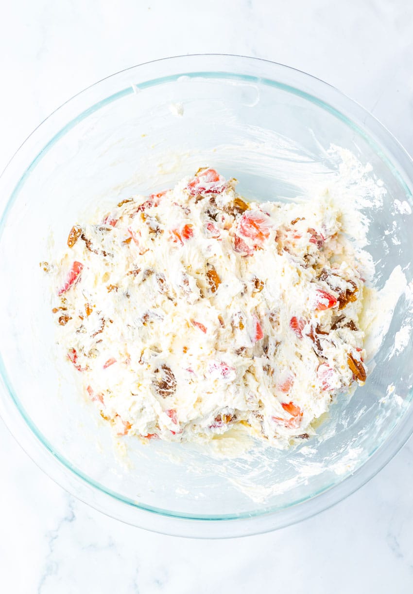 strawberry pretzel fluff salad ingredients in a large glass mixing bowl
