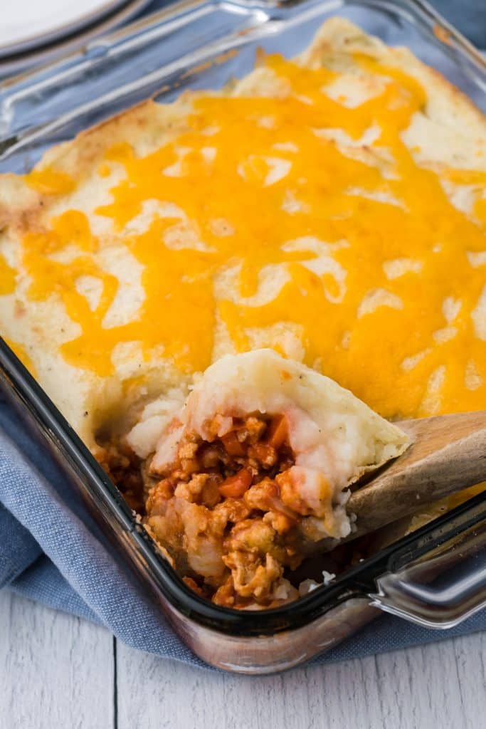 buffalo chicken shepherds pie in a square glass baking dish