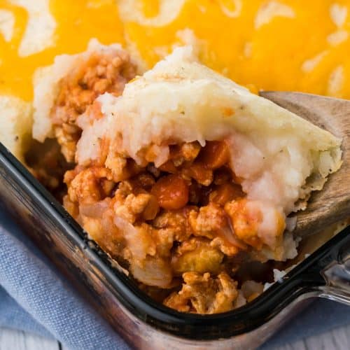 buffalo chicken shepherds pie in a square glass baking dish