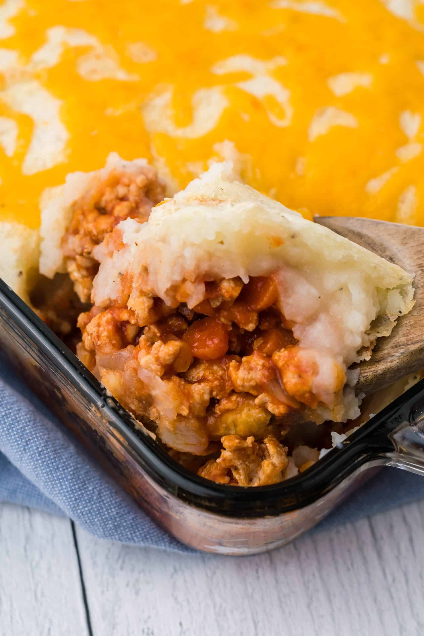 buffalo chicken shepherds pie in a square glass baking dish