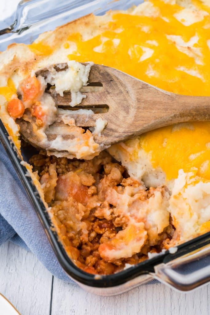 buffalo chicken shepherds pie in a square glass baking dish