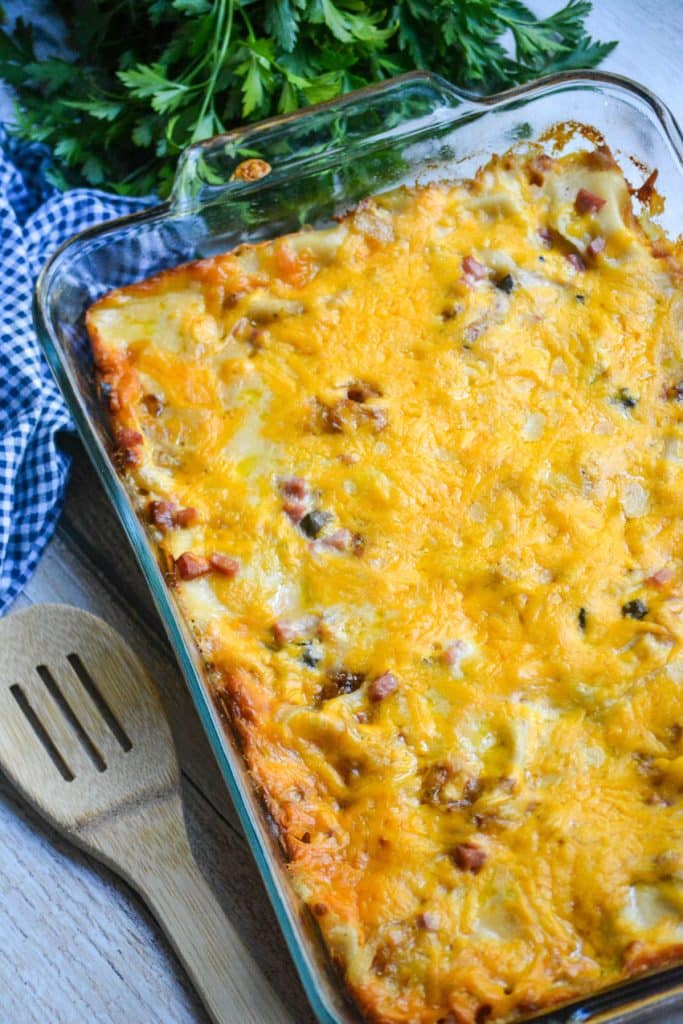 cheesy ham & pierogi casserole in a glass pyrex dish