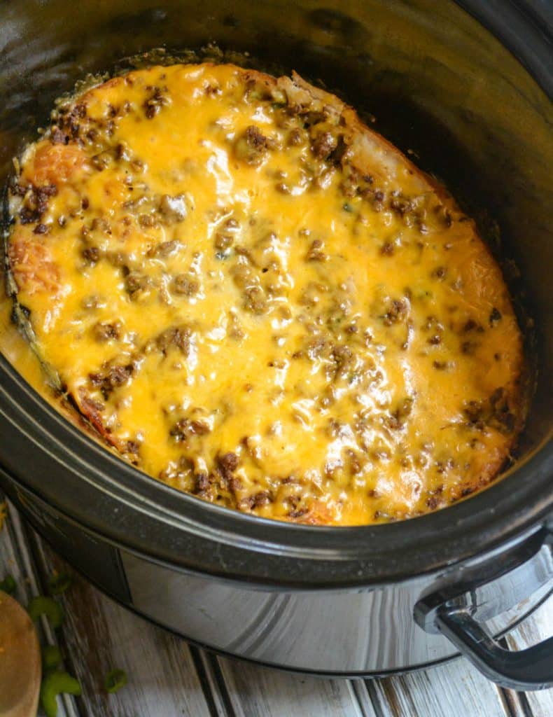 slow cooker cheeseburger casserole in the black bowl of a crockpot