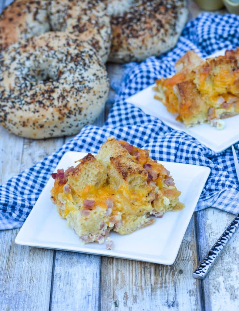 slices of ham and cheese bread pudding on small square white plates