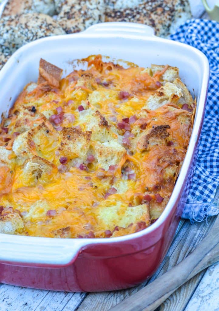 ham and cheese bread pudding in a red casserole dish