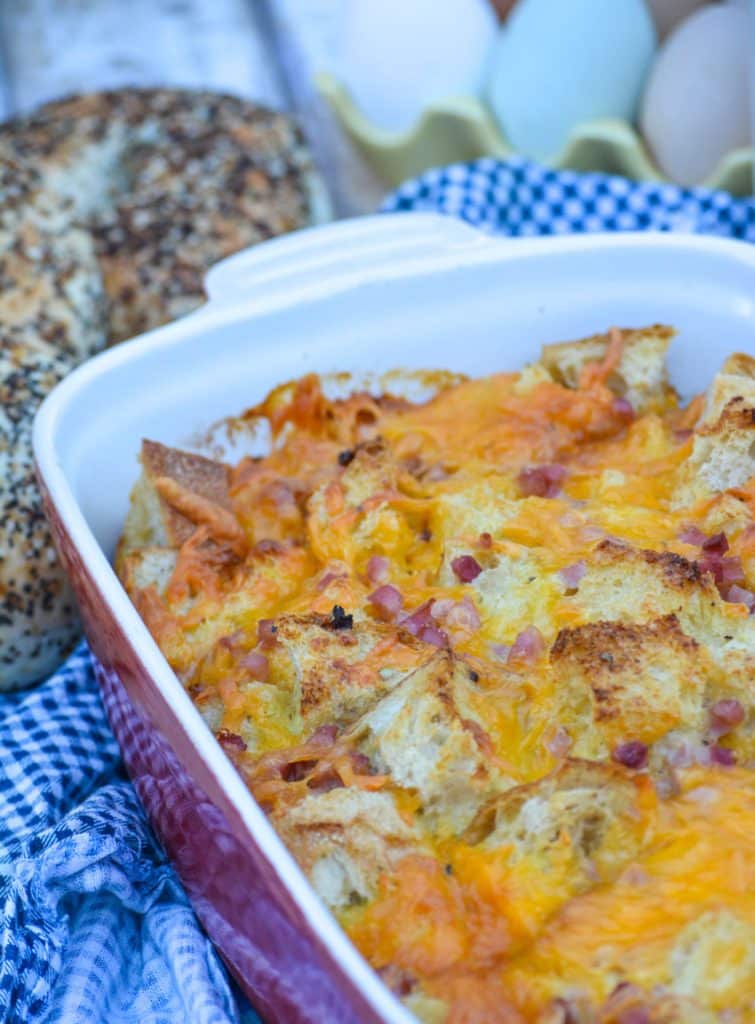 ham and cheese bread pudding in a red casserole dish