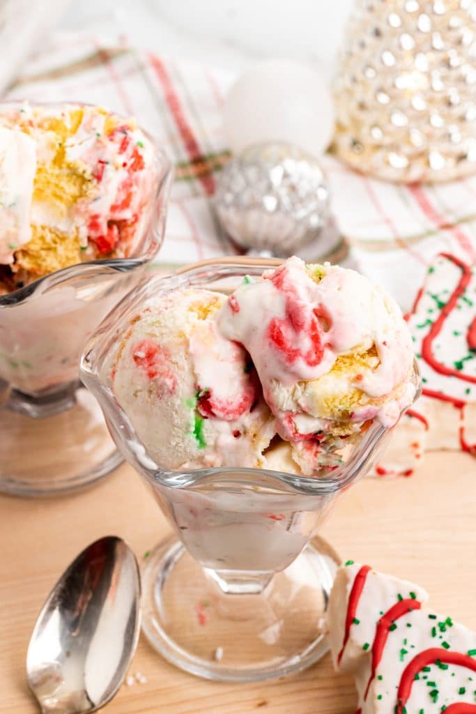 three scoops of copycat little debbie christmas tree cake ice cream in a glass ice cream bowl