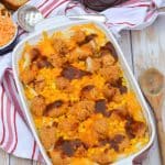 copycat kfc famous bowl casserole in a shallow red casserole dish
